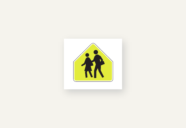 Fluorescent yellow-green school-zone sign showing two pedestrians
